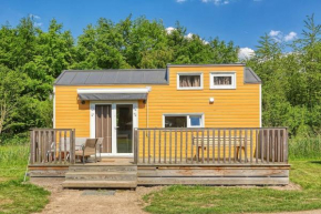 Yellow Tiny House with shared pool